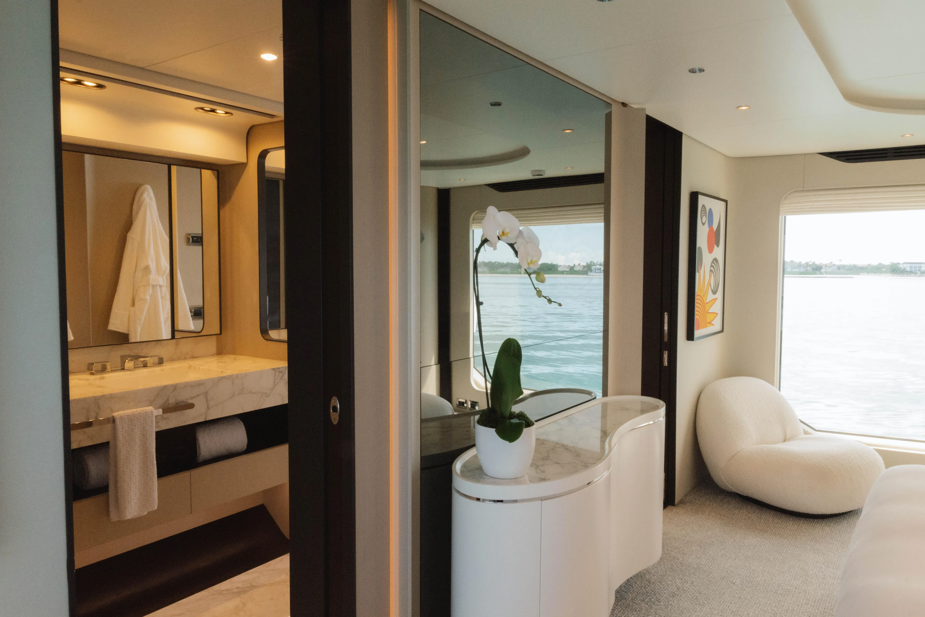 Carpe Diem Yacht Photos Pics Luxurious interior of 2023 Azimut 32M Grande yacht with elegant bathroom and seating area.