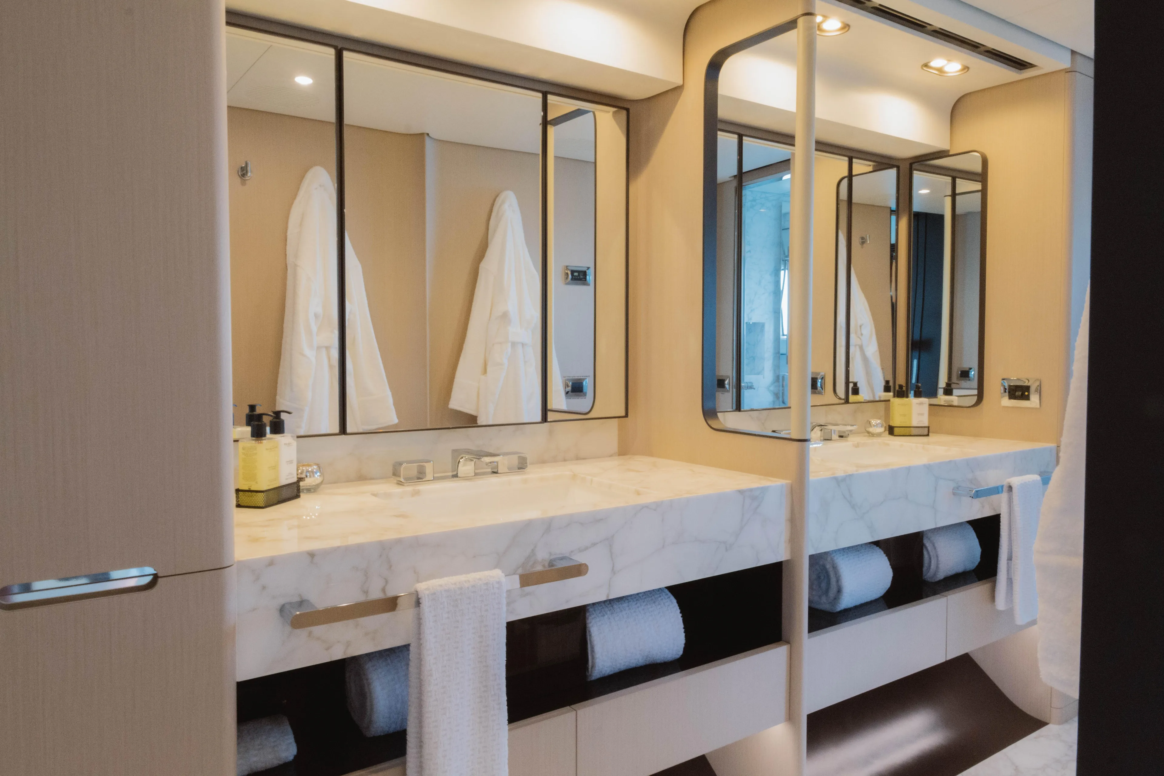 Carpe Diem Yacht Photos Pics Luxurious bathroom in 2023 Azimut 32M Grande yacht with marble countertops and modern mirrors.