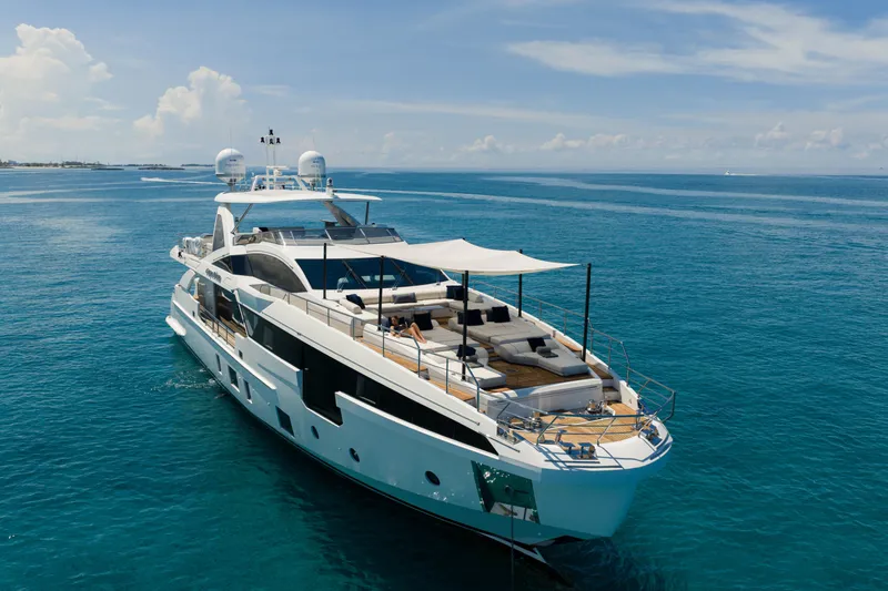 Carpe Diem Yacht Photos Pics Luxurious 2023 Azimut yacht cruising on clear blue ocean waters.