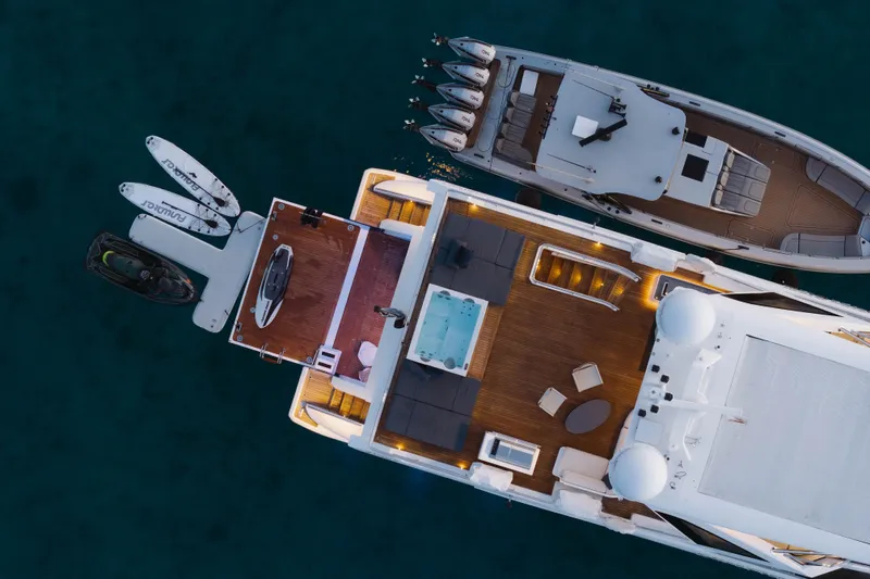 Carpe Diem Yacht Photos Pics Aerial view of luxurious 2023 Azimut yacht with deck, jacuzzi, and watercraft.