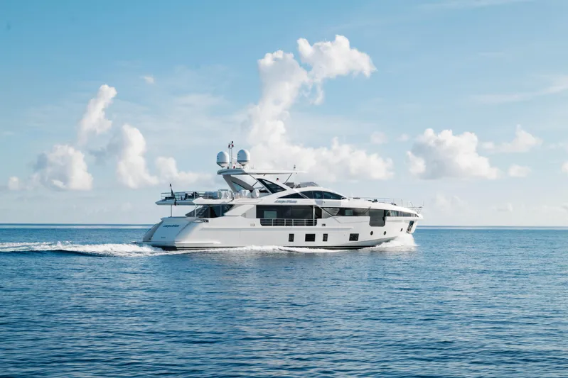Carpe Diem Yacht Photos Pics Luxury 2023 Azimut yacht cruising on open sea under clear blue sky.