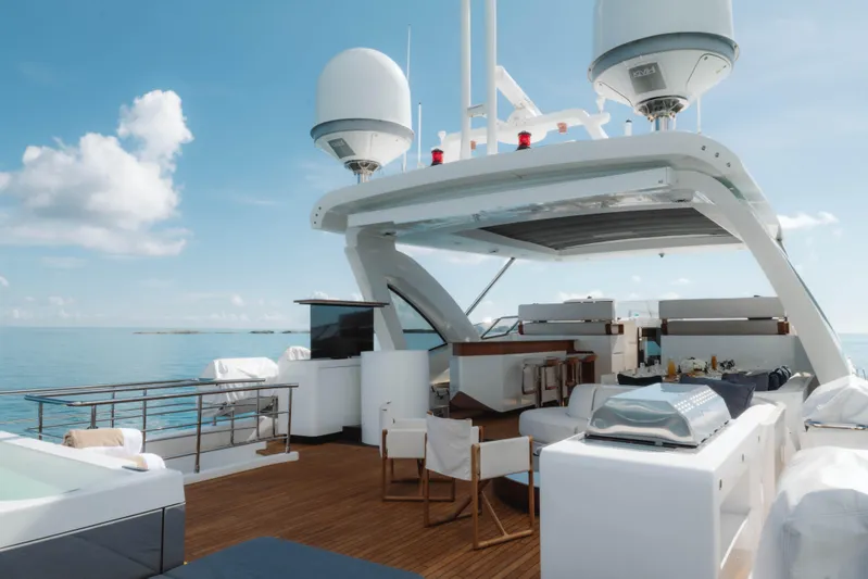 Carpe Diem Yacht Photos Pics Luxurious 2023 Azimut yacht deck with seating, dining area, and ocean view.