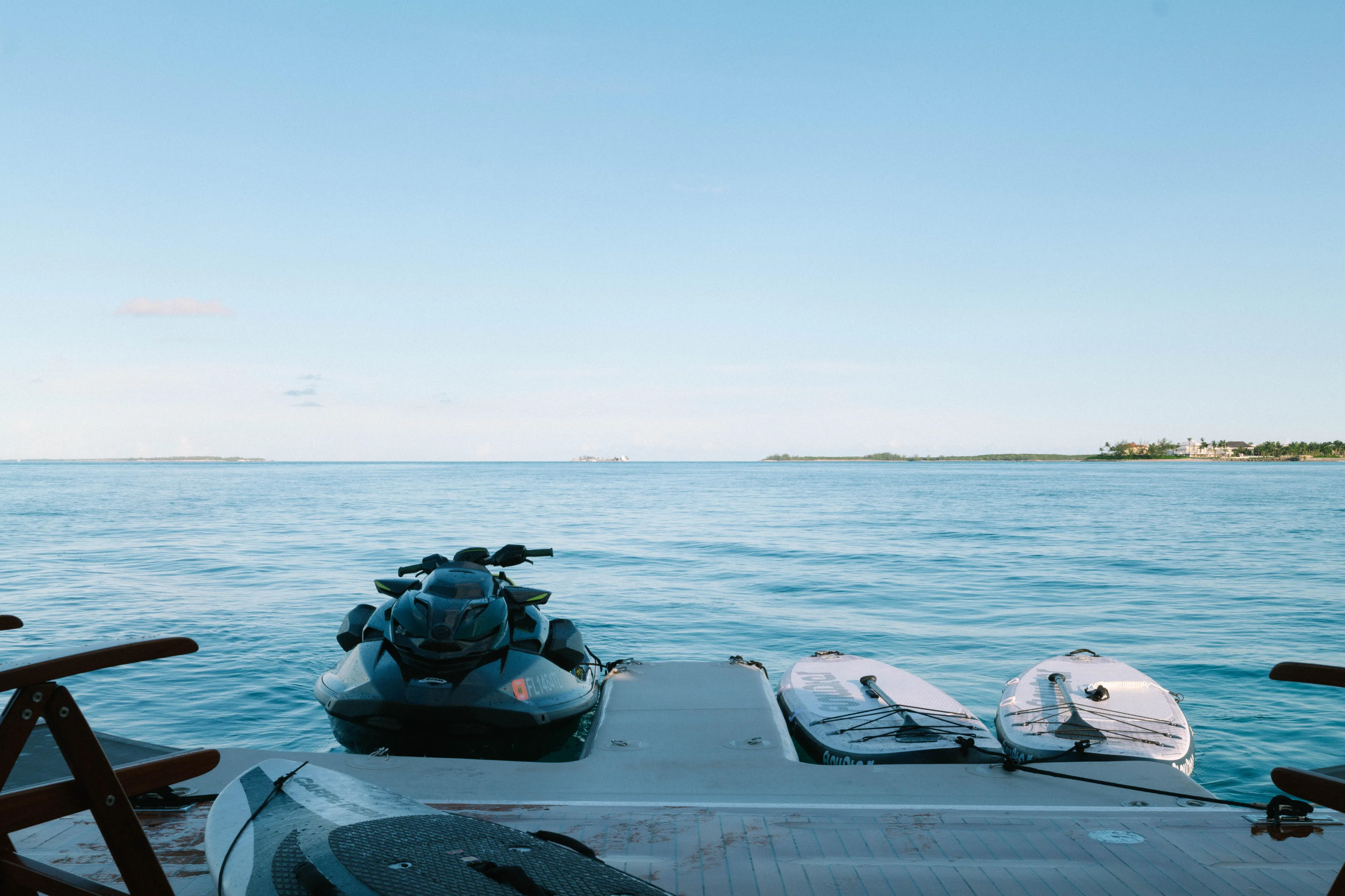 Carpe Diem Yacht Photos Pics Jet ski and paddleboards on Azimut yacht, 2023, with serene ocean view.