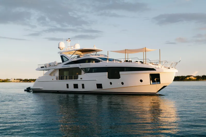 Carpe Diem Yacht Photos Pics Luxurious 2023 Azimut yacht on calm water at sunset.