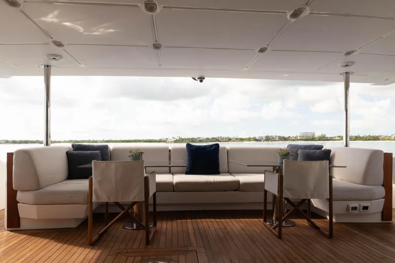 Carpe Diem Yacht Photos Pics Luxurious 2023 Azimut yacht deck with elegant seating and scenic water view.