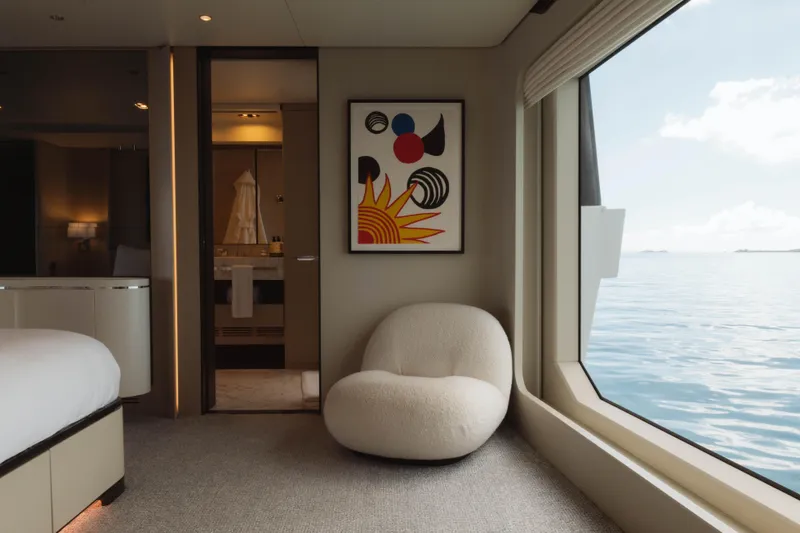 Carpe Diem Yacht Photos Pics Luxurious Azimut yacht interior with modern art, plush chair, and ocean view, 2023 model.