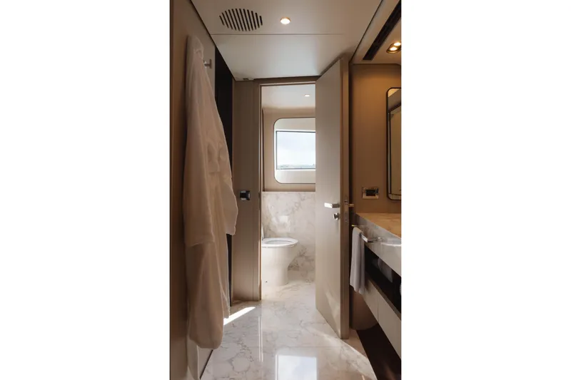 Carpe Diem Yacht Photos Pics Luxurious 2023 Azimut yacht bathroom with marble flooring and modern fixtures.