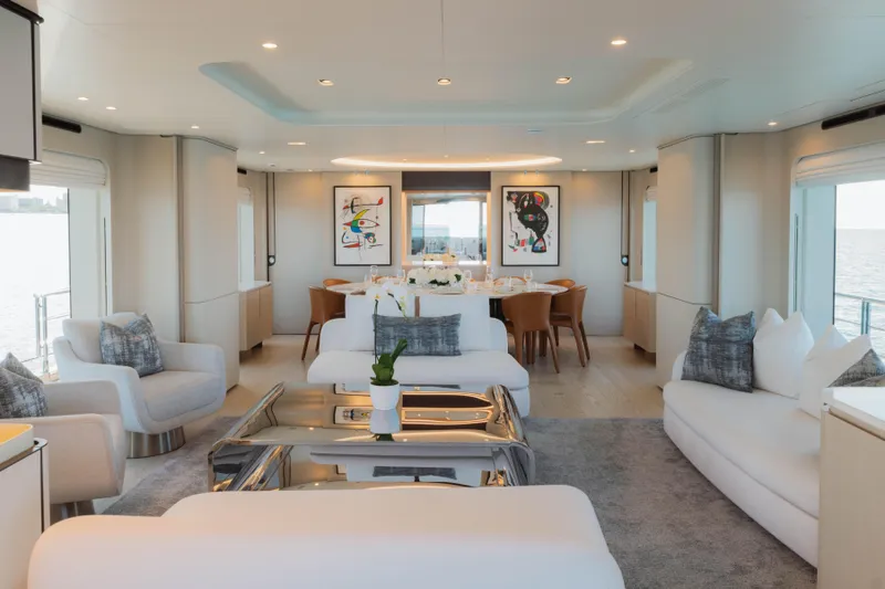 Carpe Diem Yacht Photos Pics Luxurious 2023 Azimut yacht interior with modern decor, plush seating, and elegant dining area.