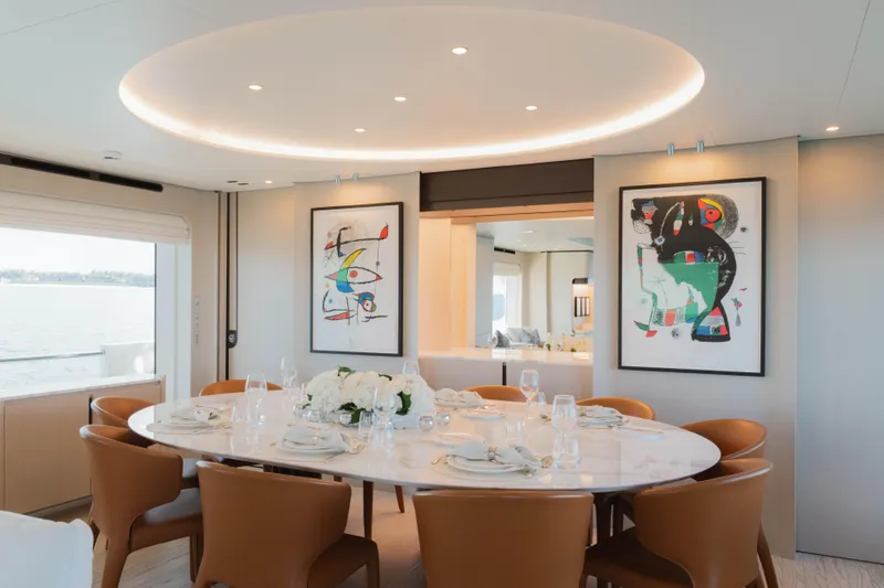 Carpe Diem Yacht Photos Pics Luxurious dining area on 2023 Azimut yacht with elegant decor and modern art.
