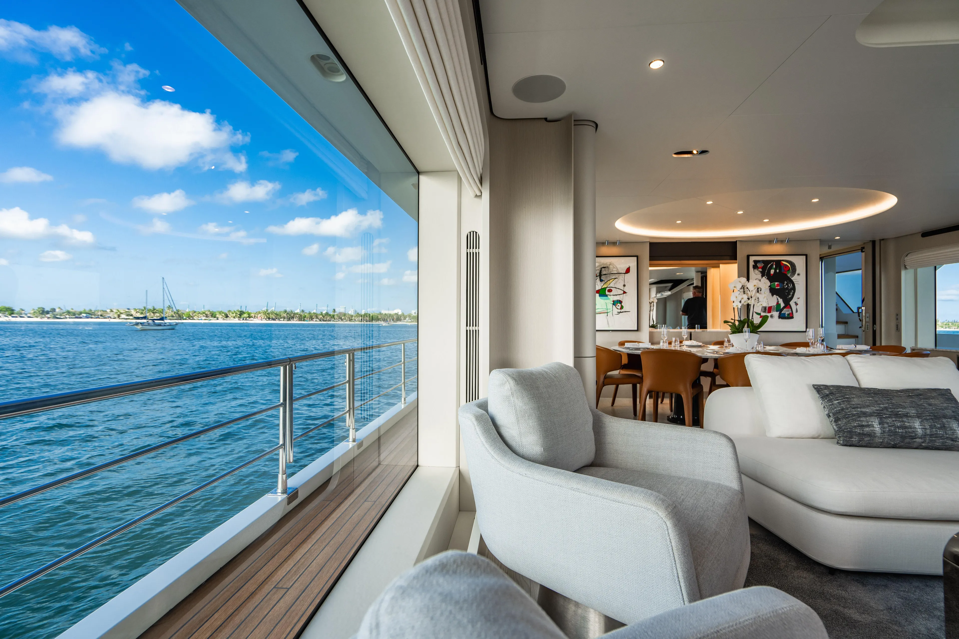 Carpe Diem Yacht Photos Pics Luxurious 2023 Azimut yacht interior with ocean view, modern decor, and elegant dining area.