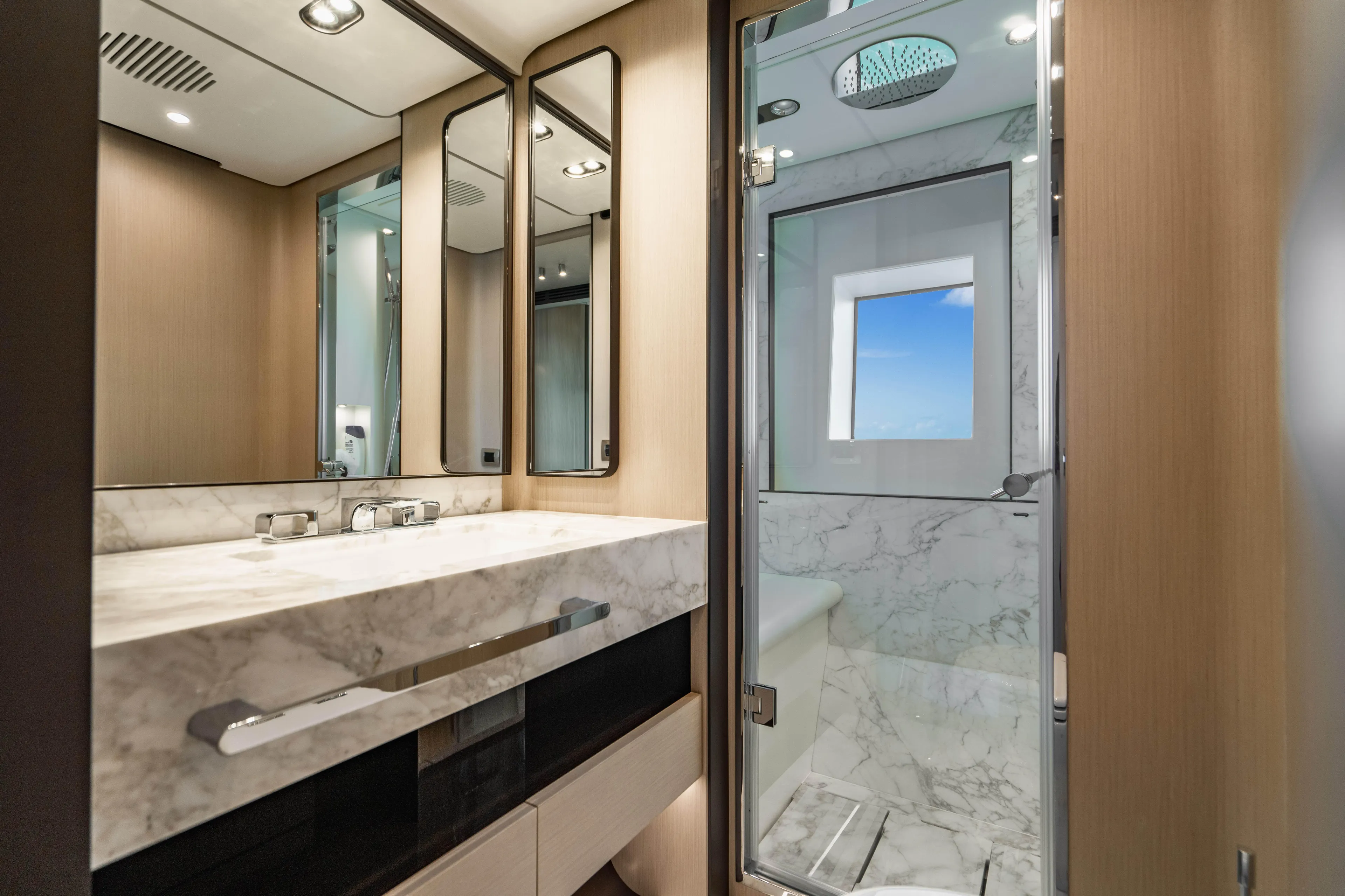 Carpe Diem Yacht Photos Pics Luxurious 2023 Azimut yacht bathroom with marble sink and modern shower.