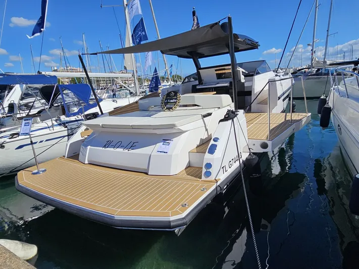 Rio 50 Yacht Photos Pics 2024 Rio Yachts Daytona 50 luxury yacht docked at marina under clear blue sky.