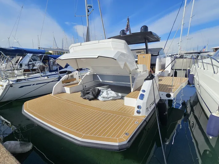 Rio 50 Yacht Photos Pics 2024 Rio Yachts Daytona 50 docked, showcasing spacious deck and sleek design.