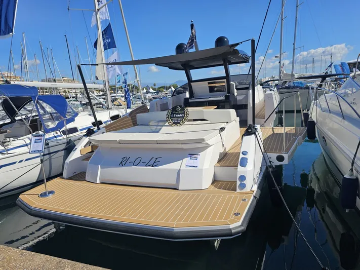 Rio 50 Yacht Photos Pics 2024 Rio Yachts Daytona 50 luxury yacht docked at marina, showcasing sleek design and spacious deck.