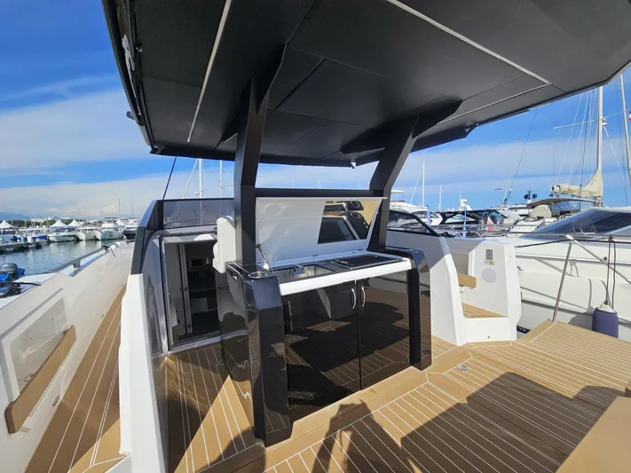 Rio 50 Yacht Photos Pics 2024 Rio Yachts Daytona 50 luxury yacht deck with modern design and marina view.