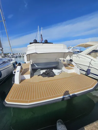 Rio 50 Yacht Photos Pics 2024 Rio Yachts Daytona 50 docked, showcasing spacious deck and sleek design.