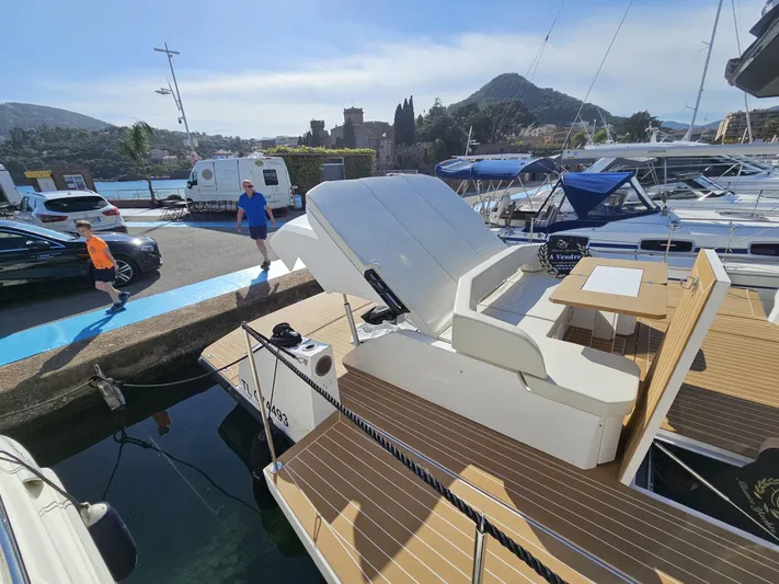 Rio 50 Yacht Photos Pics 2024 Rio Yachts Daytona 50 docked, featuring sleek design and spacious deck in a marina setting.