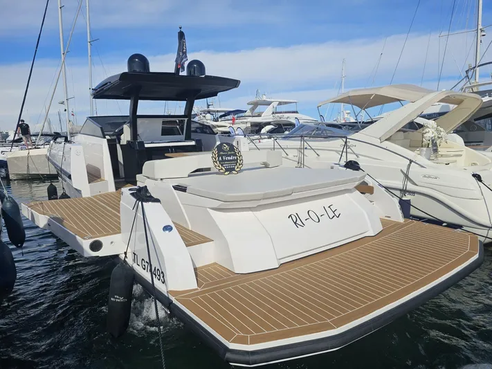 Rio 50 Yacht Photos Pics 2024 Rio Yachts Daytona 50 luxury yacht docked at marina, showcasing sleek design and spacious deck.