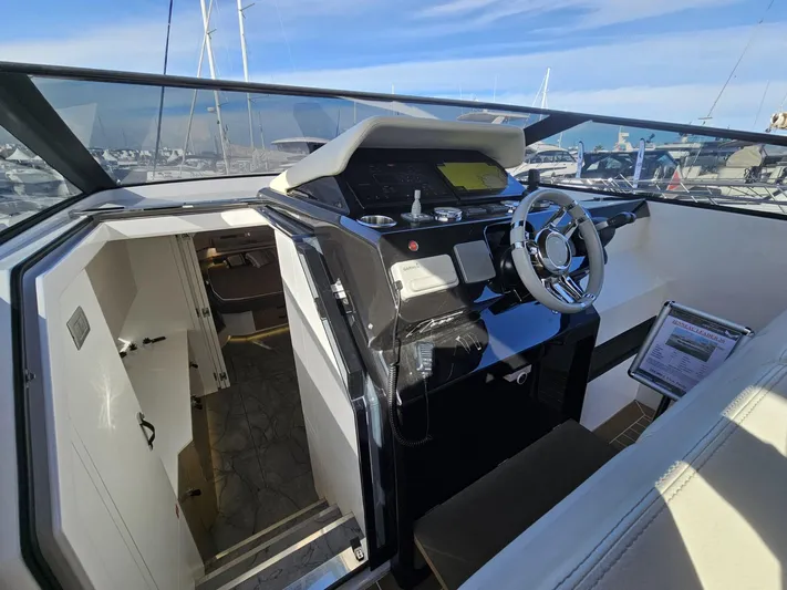 Rio 50 Yacht Photos Pics 2024 Rio Yachts Daytona 50 cockpit with modern steering and navigation controls.