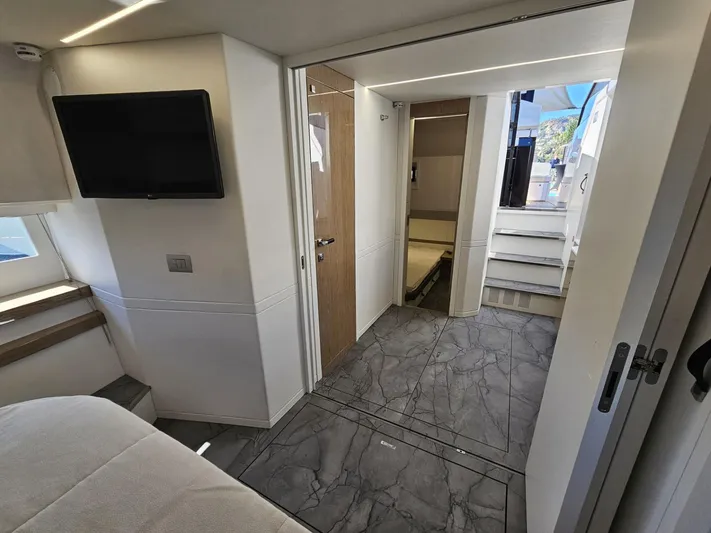 Rio 50 Yacht Photos Pics 2024 Rio Yachts Daytona 50 interior with modern design, featuring a TV and sleek flooring.