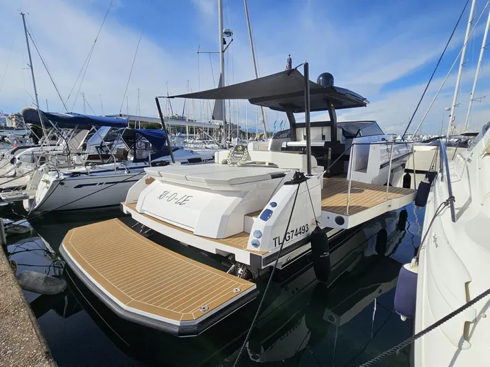 Rio 50 Yacht Photos Pics 2024 Rio Yachts Daytona 50 docked, showcasing sleek design and spacious deck.