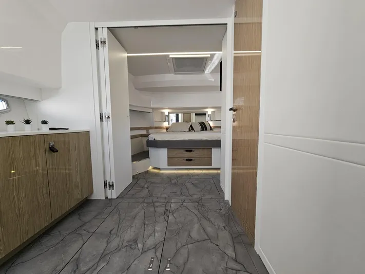 Rio 50 Yacht Photos Pics 2024 Rio Yachts Daytona 50 interior with modern design, featuring a spacious bedroom and elegant flooring.