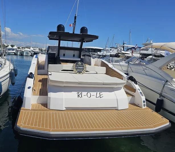 Rio 50 Yacht Photos Pics 2024 Rio Yachts Daytona 50 docked at marina, showcasing sleek design and spacious deck.