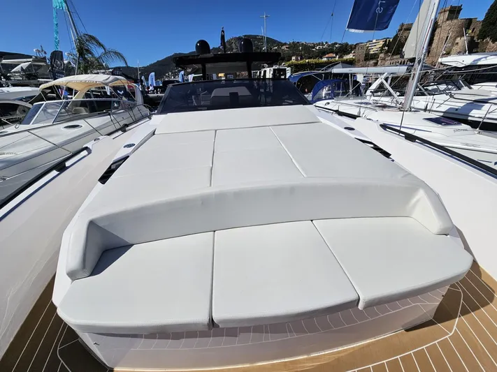Rio 50 Yacht Photos Pics 2024 Rio Yachts Daytona 50 luxury deck with sunbathing area at a marina.