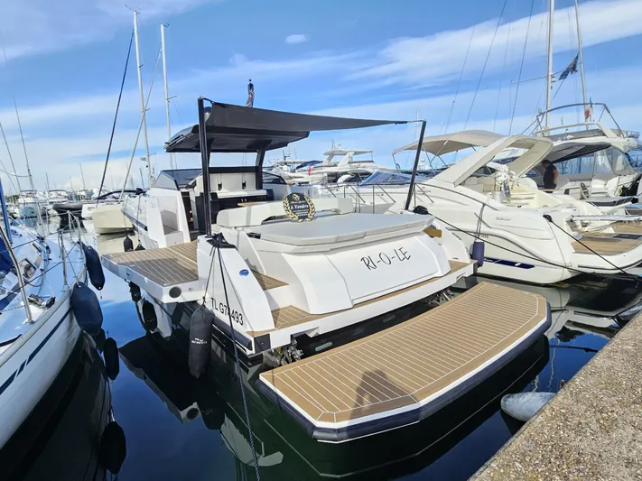 Rio 50 Yacht Photos Pics 2024 Rio Yachts Daytona 50 docked at marina, featuring sleek design and spacious deck.