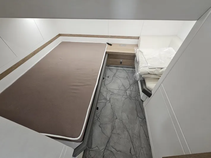 Rio 50 Yacht Photos Pics Luxurious cabin interior of 2024 Rio Yachts Daytona 50 with modern design and comfortable bedding.