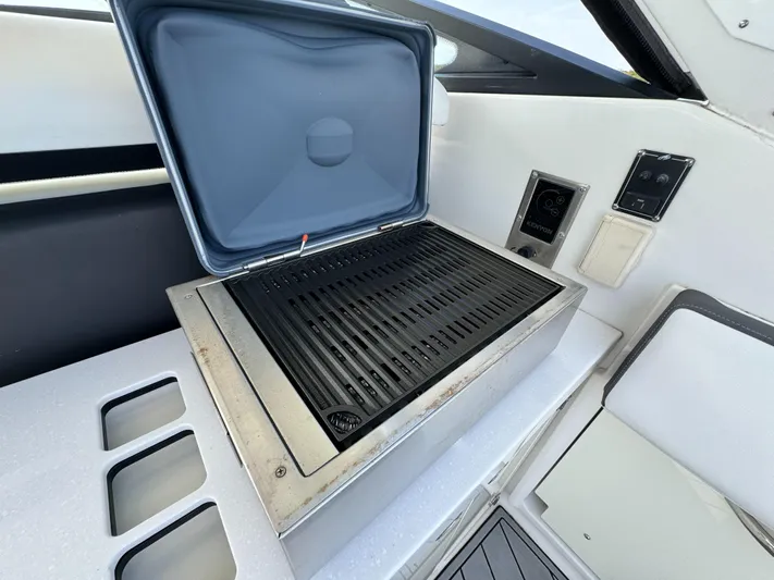 Fanta Sea Yacht Photos Pics Built-in grill on 2018 Monterey 378 Super Express yacht, featuring sleek design and modern controls.