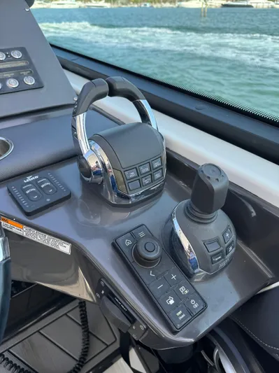 Fanta Sea Yacht Photos Pics Control panel of 2018 Monterey 378 Super Express boat with throttle and joystick.