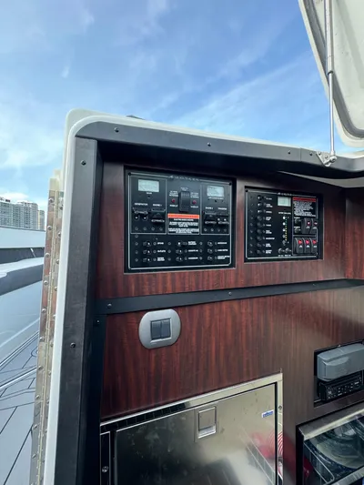 Fanta Sea Yacht Photos Pics Control panel of a 2018 Monterey 378 Super Express boat with wood finish.
