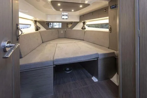 My Angel Yacht Photos Pics 2023 Beneteau GT32 interior cabin with cozy seating and modern design.