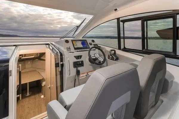 My Angel Yacht Photos Pics 2023 Beneteau GT32 boat interior with helm, seating, and cabin view.