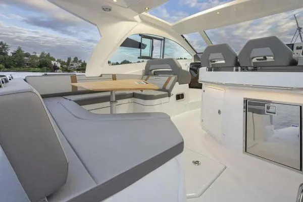 My Angel Yacht Photos Pics 2023 Beneteau GT32 yacht interior with modern seating and dining area.