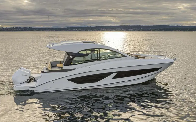 My Angel Yacht Photos Pics 2023 Beneteau GT32 yacht on calm water at sunset.