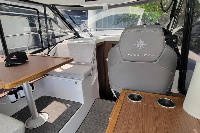 Tagwood Bbq Yacht Photos Pics Interior of 2023 Jeanneau NC 895 boat with seating and table.