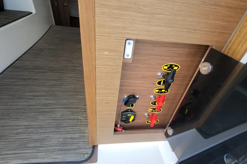 Tagwood Bbq Yacht Photos Pics Electrical panel on 2023 Jeanneau NC 895 boat, featuring switches and controls.
