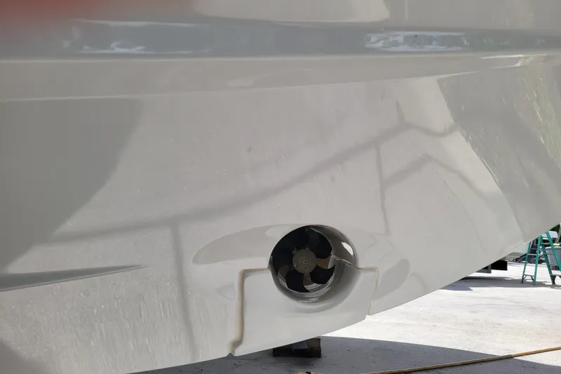 Tagwood Bbq Yacht Photos Pics 2023 Jeanneau NC 895 boat hull with visible thruster detail.