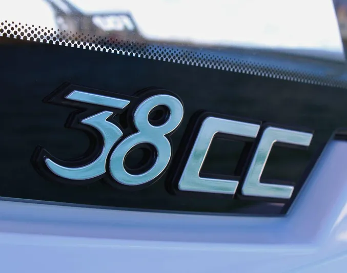  Yacht Photos Pics 2025 Fountain 38 CC logo on a sleek black surface.