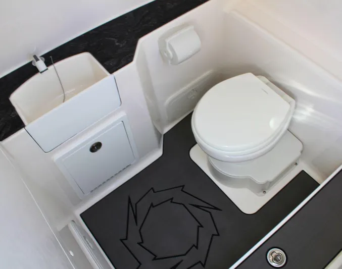  Yacht Photos Pics 2025 Fountain 38 CC boat bathroom with modern toilet and sink.