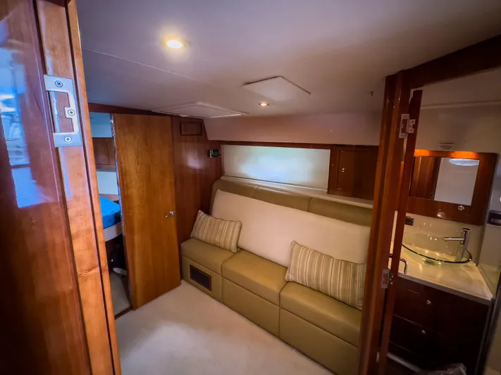  Yacht Photos Pics Luxurious interior of 2012 Riviera 50SY yacht with sofa and modern bathroom.