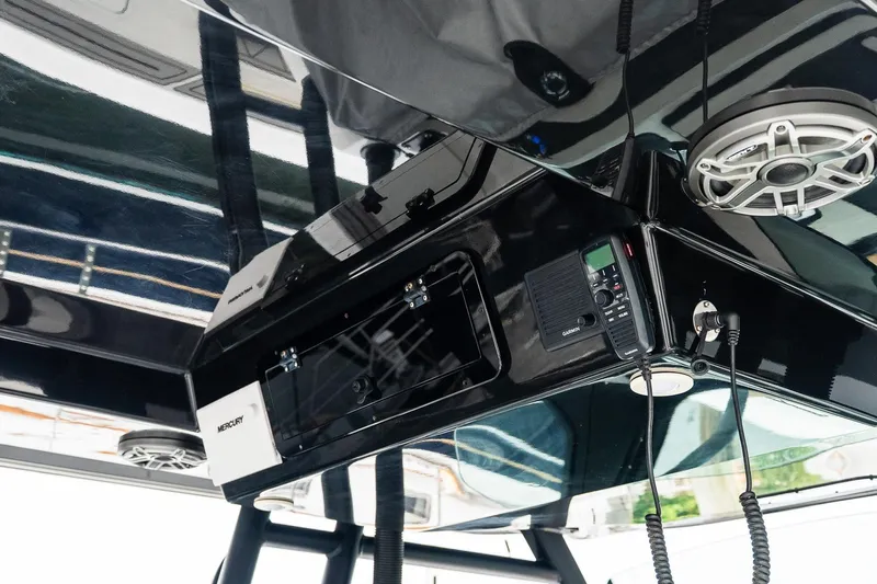  Yacht Photos Pics 2021 Wellcraft 402 Fisherman boat console with speakers and communication equipment.