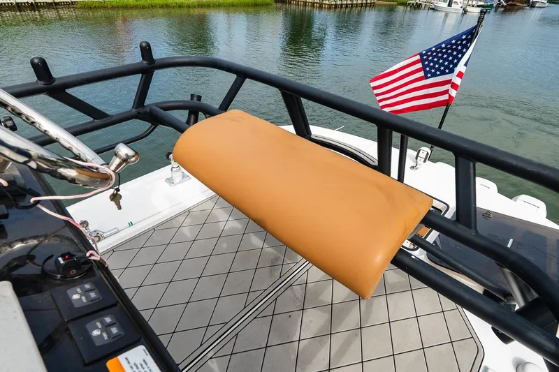  Yacht Photos Pics 2021 Wellcraft 402 Fisherman boat deck with American flag and cushioned rail.
