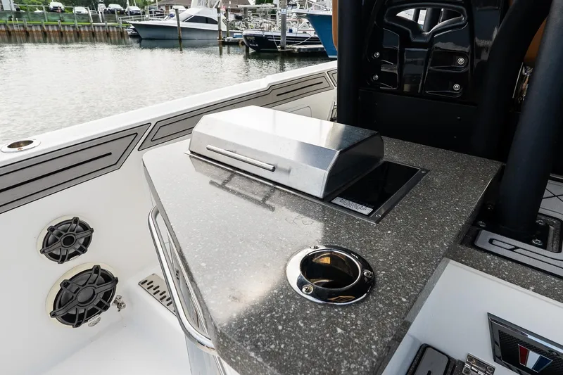  Yacht Photos Pics 2021 Wellcraft 402 Fisherman boat with sleek countertop and built-in grill.