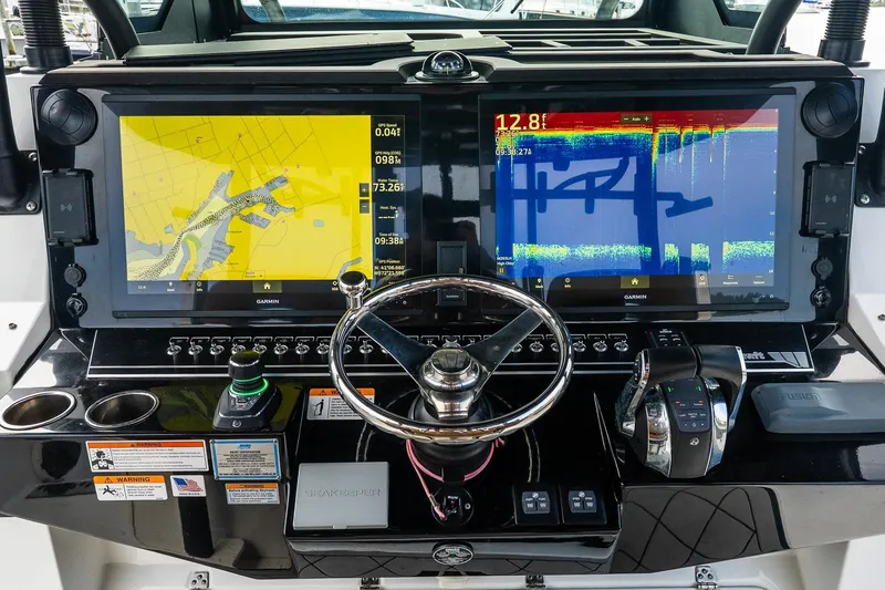  Yacht Photos Pics 2021 Wellcraft 402 Fisherman dashboard with dual Garmin displays and steering wheel.