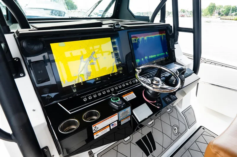  Yacht Photos Pics 2021 Wellcraft 402 Fisherman helm with advanced navigation displays and steering wheel.