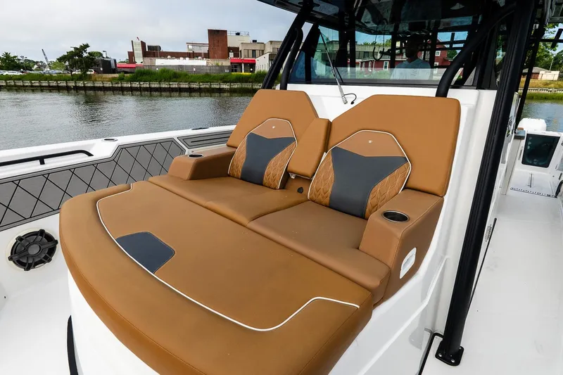  Yacht Photos Pics Luxurious seating on 2021 Wellcraft 402 Fisherman boat, featuring brown and black cushioned seats.