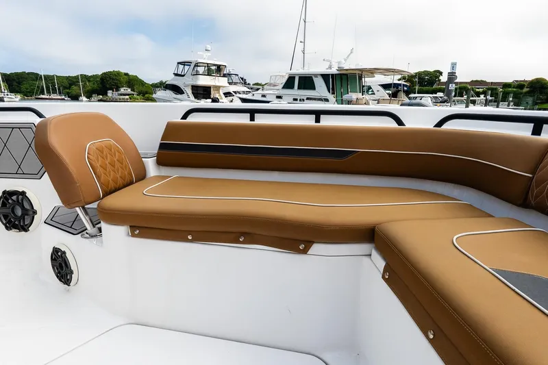  Yacht Photos Pics Luxurious seating on 2021 Wellcraft 402 Fisherman boat, docked with other vessels in background.
